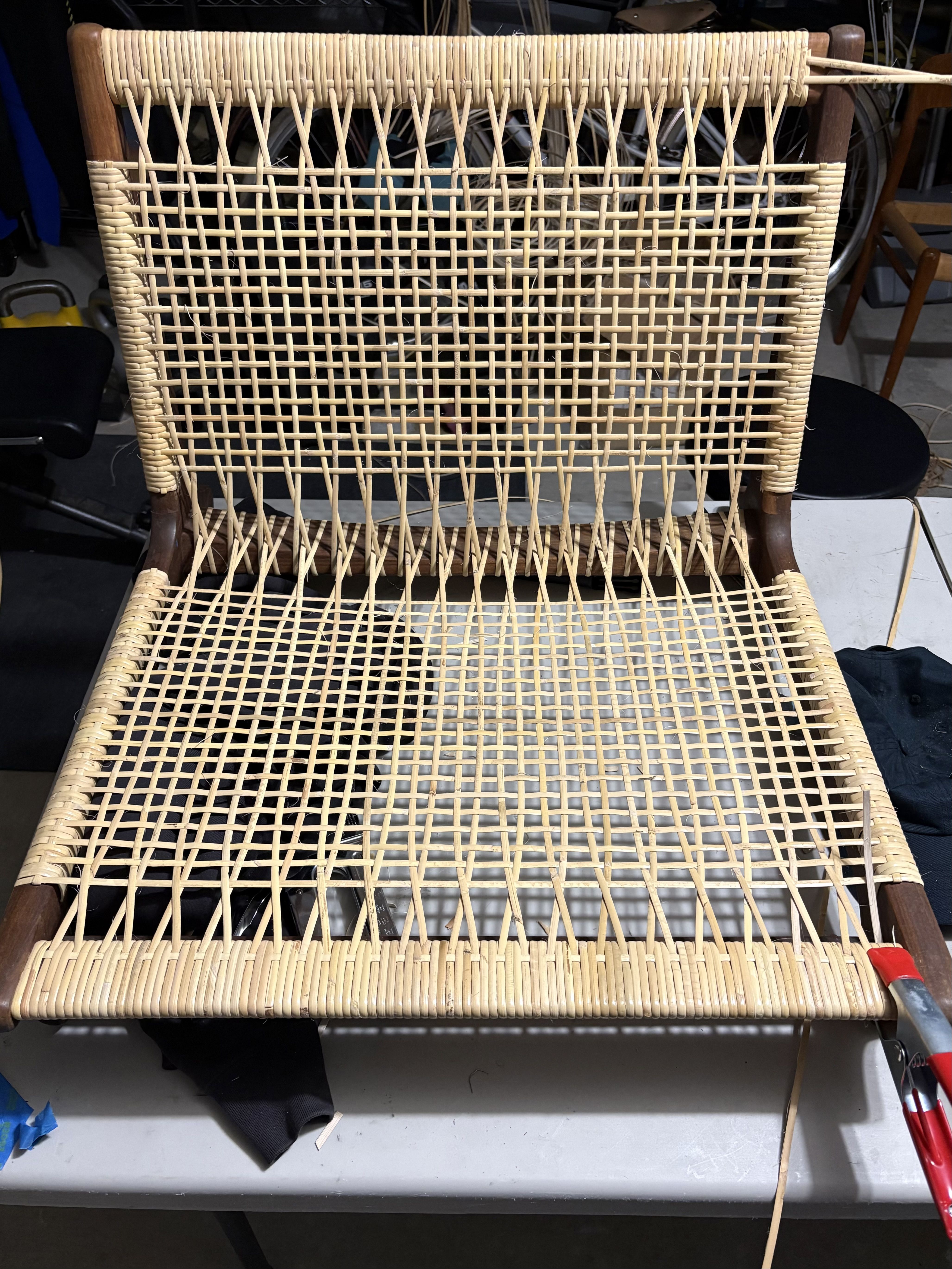 Rattan woven chair seat and back restoration in progress, Bay Area